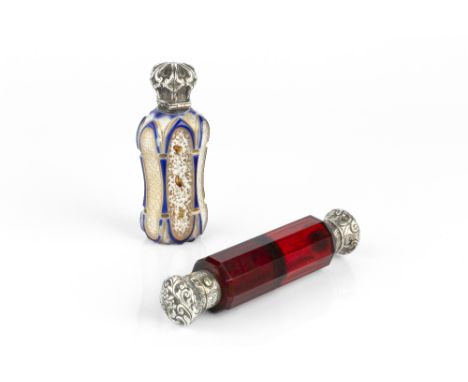 A CONTINENTAL LATE 19TH CENTURY BLUE OVERLAID WHITE GLASS SCENT BOTTLE, the waisted and panelled body painted and gilded with