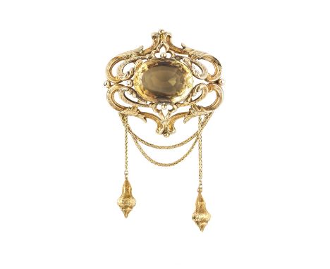 A VICTORIAN CITRINE PANEL BROOCH, the oval mixed-cut citrine in pinched collet setting, to a tiered openwork panel of foliate
