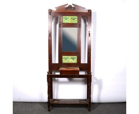 Edwardian stained wood hallstand, architectural pediment, mirrored and tiled back above a glove box, width 86cm, depth 31cm, 