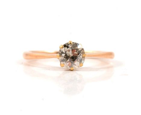 A diamond solitaire ring, the old brilliant cut stone claw set in an all yellow metal mount ring size K, approximate weight o