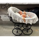 A Victorian style dolls pram with dolls COLLECT ONLY