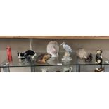 A quantity of animal ornaments including cats, horses, peacock etc