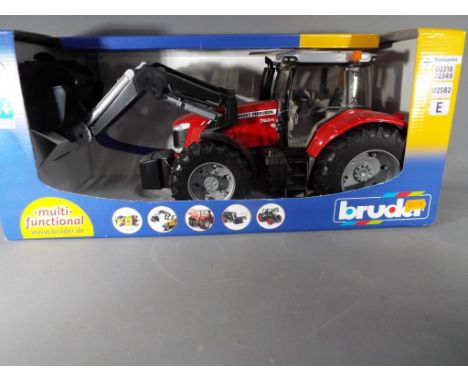 A boxed Bruder Massey Ferguson 7624 tractor in mint condition, scale 1:16.