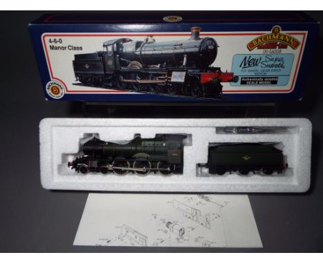 Bachmann - a boxed Bachmann OO Gauge Manor Class 4-6-0 steam locomotive and tender, 31306 Op.No.7822 'Foxcote Manor' in BR Gr