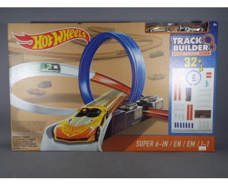 Hot Wheels - A boxed Hot Wheels Super 6-In Track Builder Sytem. The item is retail stock and is factory sealed.