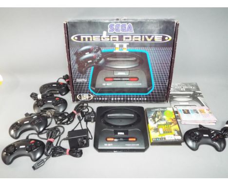 Sega - A boxed Sega Mega II console with five controllers, instructions and a boxed Jungle Strike game cartridge.