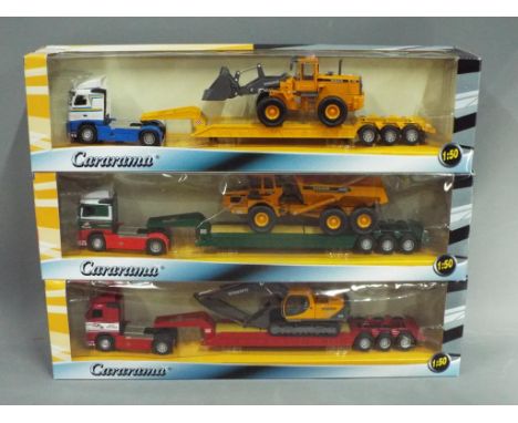 Cararama - Three boxed 1:50 scale diecast model trucks with low loader trailer and loads. All three models appear to be in Mi