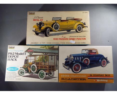 Hubley, Gabriel  - Three boxed Hubley / Gabriel Metal 1:22 scale Model Kits.Lot consists of #26443 1912 Model T Depot Hack; #