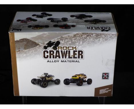 Rock Crawler - A boxed Rock Crawler 6288A 1:16 scale short course off-road race truck. The item appears to be in a factory se