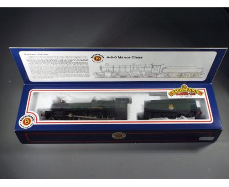 Bachman - A boxed Bachmann 31301 OO Gauge 4-6-0 Manor Class steam locomotive and tender, Op.No. 7820 'Dinmore Manor' in BR Gr
