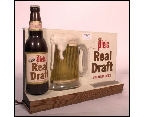A good 20th century, circa 1970's Piels Beer Real Draft light up pub / shop advertising sign having good colours with light u