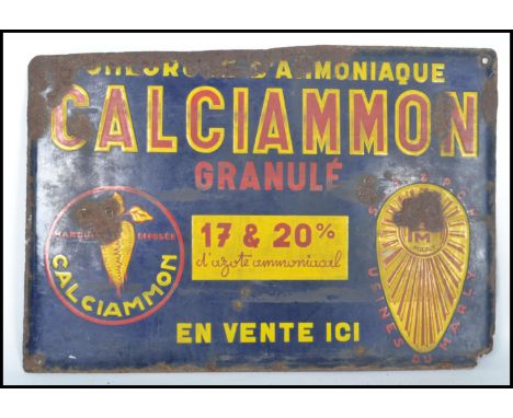 A vintage 1930's Art Deco French enamel industrial advertising sign for Calciammon Granule. The blue ground with red and yell