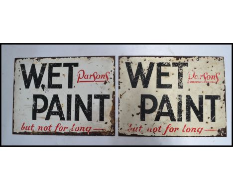 A pair of vintage early 20th century Industrial ' Wet Paint - But Not For Long- ' enamel signs. White ground with black borde
