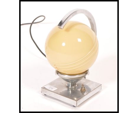 A 1930's Art Deco chrome and glass globe desk&nbsp; / table lamp. The chrome square plinth base with flicker switch having c-