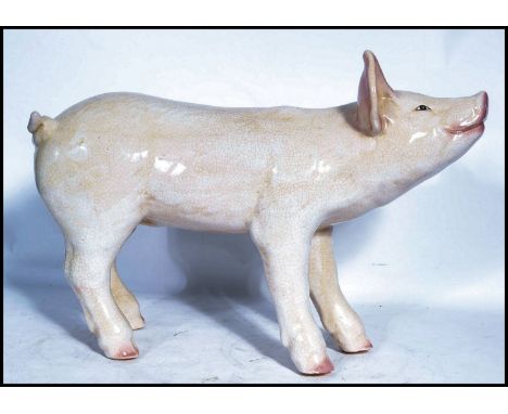 A vintage early 20th century advertising point of sale Butchers shop window large ceramic model of a pig. The pig modelled st