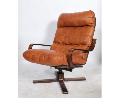 Ring Mekanikk - A Norwegian retro 20th century vintage swivel lounge chair, having a bentwood base and armrests with the Ring