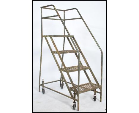 A stunning&nbsp; vintage / retro industrial - Library - mobile ladder constructed from a tubular metal frame having cup and c
