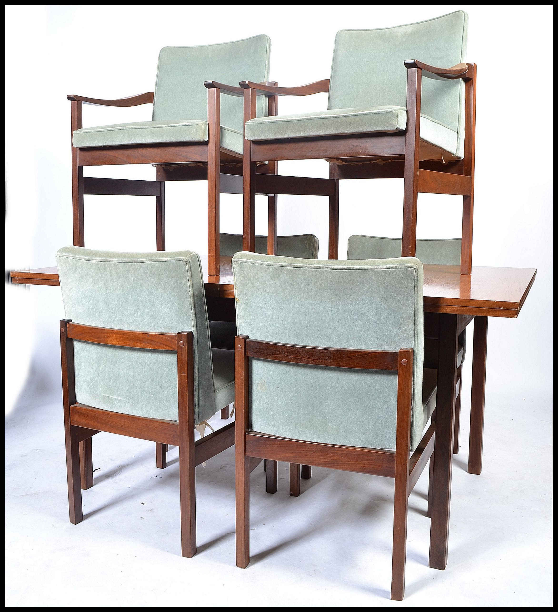 A 1970's believed Heals of London teak wood dining table and 6 chairs