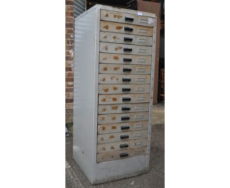 An Industrial mid century pedestal enamel painted metal filing cabinet having multiple drawers in original silvered paintwork