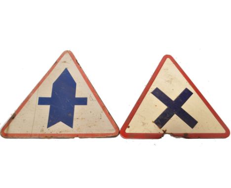 A pair of early 20th century enamel painted metal French street warning signs. Each of triangular form with red borders and b