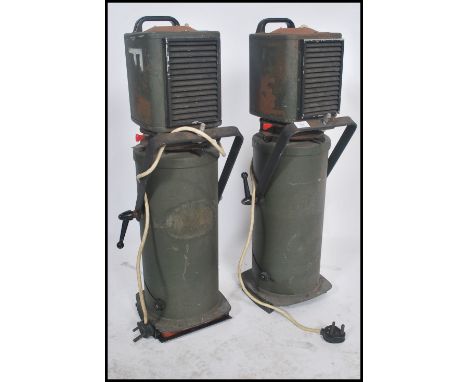 A pair of large vintage mid century Strand Electric theatre - cinema spotlights having makers plaque to the top, green origin