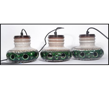 A set of 3 1970's retro West German ' Fat Lava ' style ceramic drip glaze hanging pendant lights in an unusual green colourwa