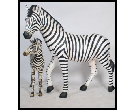 A stunning life-size resin painted grand scale adult female Zebra sculpture together with a Zebra foal sculpture. The paintwo