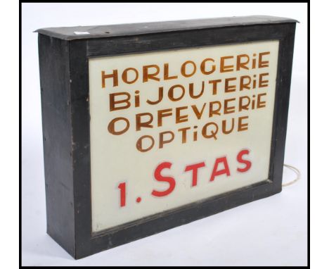 A rare 1930's large French double sided tin and glass light box / light up shop sign. The white glass panels with notation fo