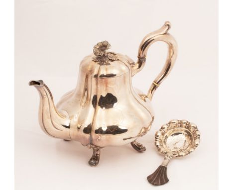 A Danish silver teapot, of melon-shape with flower finial, on four paw feet, ivory heat absorbers to handle, 19cm high and a 