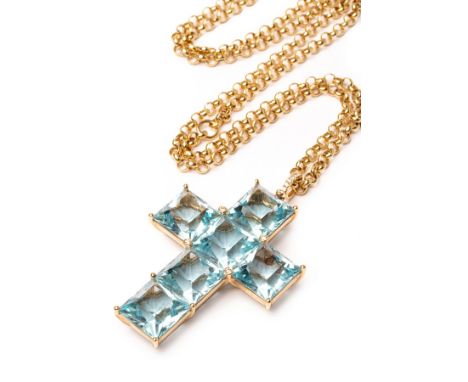 A contemporary blue topaz cruciform pendant, by Kiki McDonough, set with six square scissor cut stones, with four diamond acc