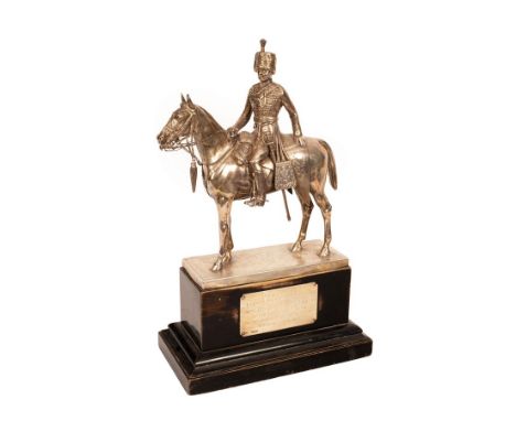 A silver figure of a Royal Gloucestershire Hussar on a rectangular stained plinth base, Goldsmiths & Silversmiths Co. London 