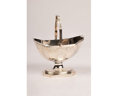 A George III silver sugar basin, Henry Chawner, London 1793, of lozenge form with loop handle and raised on an oval stepped b