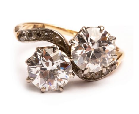 An early 20th Century 'toi et moi' diamond ring, the two round culet cut diamonds approximately 1.5cts each, assessed clarity