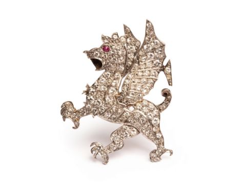 An early 20th Century diamond brooch in the form of a Welsh dragon, pavé set graduated round cut diamonds with a round cut ru