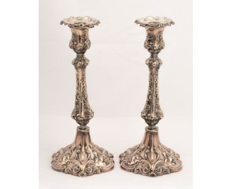 A pair of silver plated candlesticks, R&amp;J Slack, Strand, with trailing vine decorations to the stems, 29.5cm high CONDITI