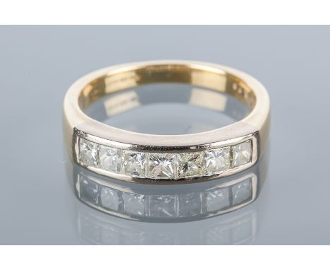 DIAMOND HALF ETERNITY RING
with seven channel set princess cut diamonds totalling approximately 0.75 carats, in eighteen cara