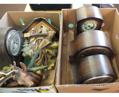 Four Oak striking mantel clocks plus a cuckoo clock (two boxes)