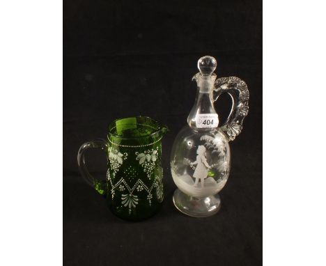 A Victorian Mary Gregory decanter and a green jug