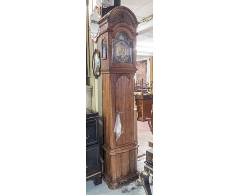 18TH CENTURY CONTINENTAL LONGCASE CLOCK, oak with carved and shaped detail, bell striking movement, the brass face with silve