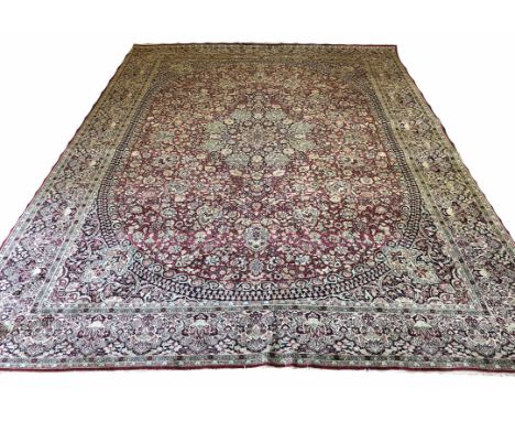 FINE PURE SILK PERSIAN TEHRAN DESIGN CARPET, 360cm x 270cm, central medallion on a ruby palmette and vine field within compli