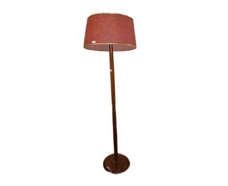20th century standard lamp with large red shade, on circular base 