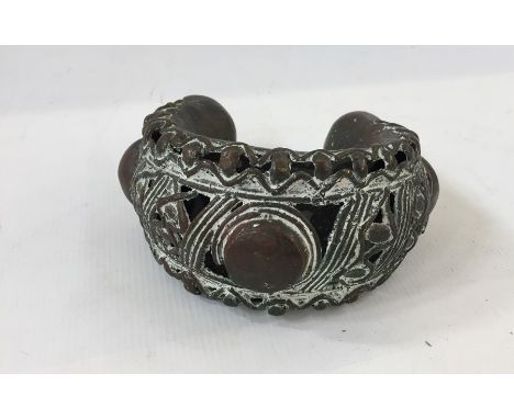 West African(?) bronze cuff bracelet, pierced decoration with circle and lozenge relief