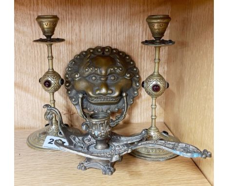A pair of 19thC jewelled brass candle sticks (one jewel missing) together with a phoenix metal chamber stick and a brass door