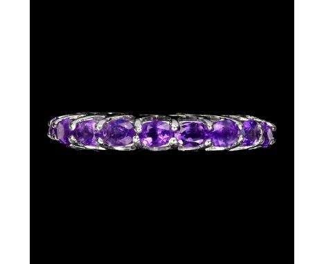 A 925 silver full eternity ring set with oval cut amethysts, ring size N.