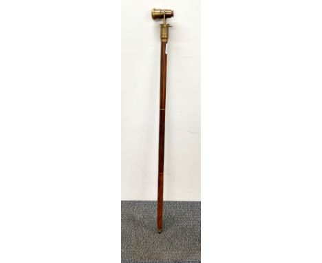A folding monocular walking stick.