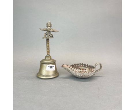 A 19thC Himalayan bronze / brass bell, H. 23cm together with a hammered copper candle holder. Prov F. Collins collection.