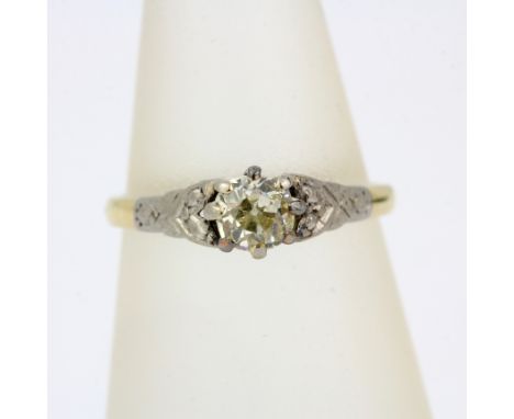 A yellow and white metal (tested minimum 9ct gold) diamond set solitaire ring, approx. 0.33ct, (L.5).