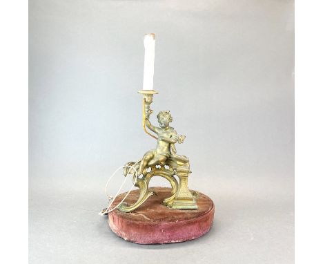 A 19thC brass figure of a cherub mounted as an electric table lamp base, overall H. 56cm.