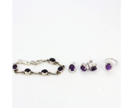 A 925 silver and cabochon amethyst jewellery suite consisting of a pair of earrings, a ring and a pendant together with a sil