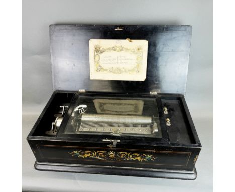 A large 19thC Swiss music box in working order, 71 x 36 x 21cm. Comb incomplete.